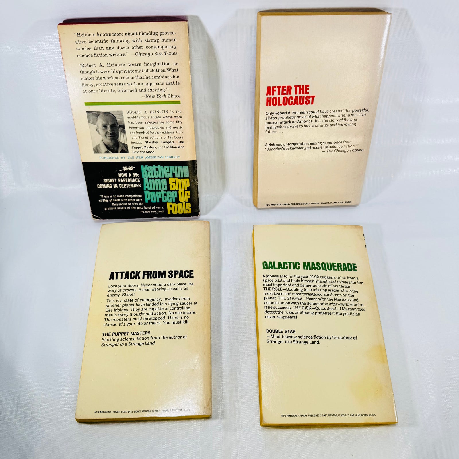 Back covers of four vintage Heinlein Signet paperbacks