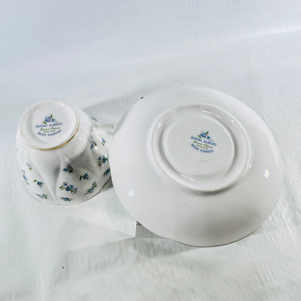 Underside of the Royal Albert Blue Heaven teacup and saucer showing both backstamps