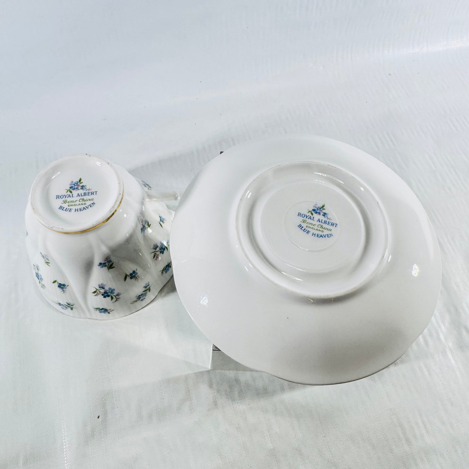 Underside of the Royal Albert Blue Heaven teacup and saucer showing both backstamps