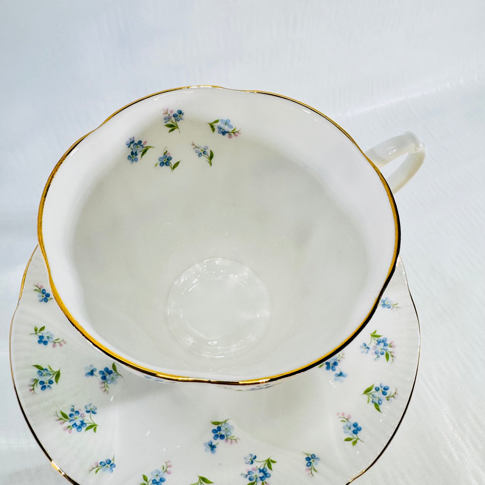 Overhead view of the Royal Albert Blue Heaven teacup and saucer showing the inner rim pattern