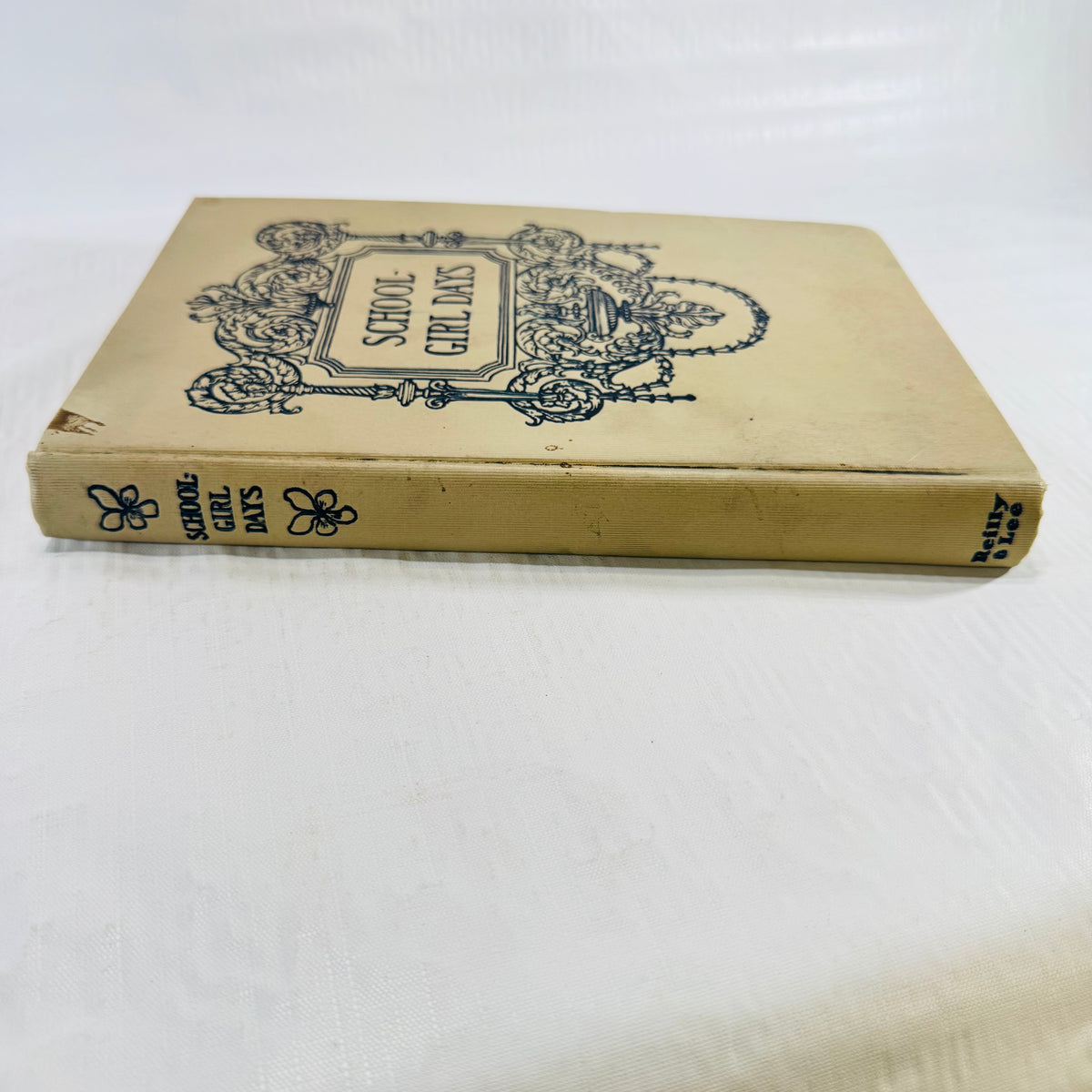 Front cover and spine with Reilly and Lee printed at the foot