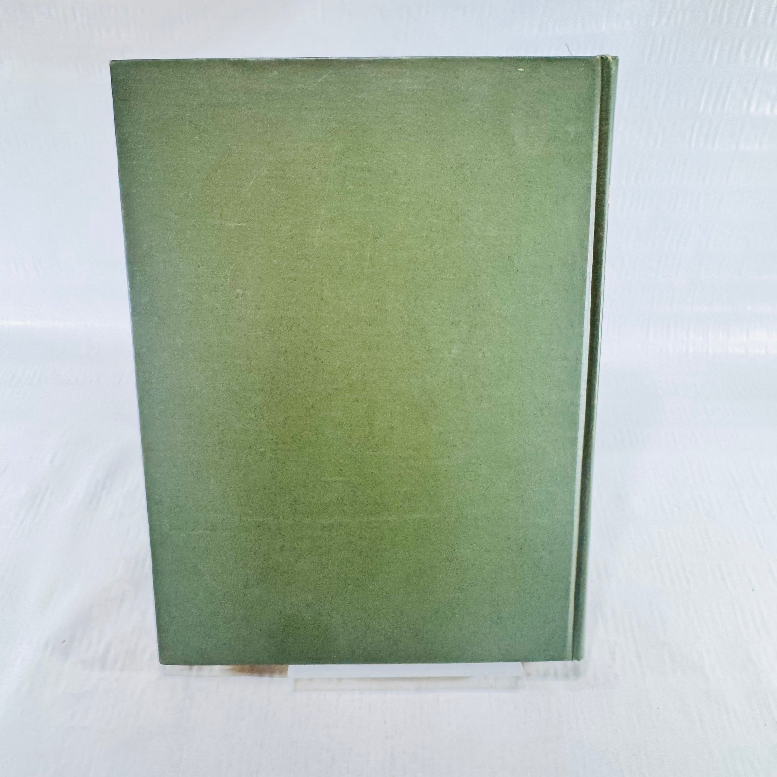 Plain olive green cloth back cover of the 1906 Hiawatha hardcover