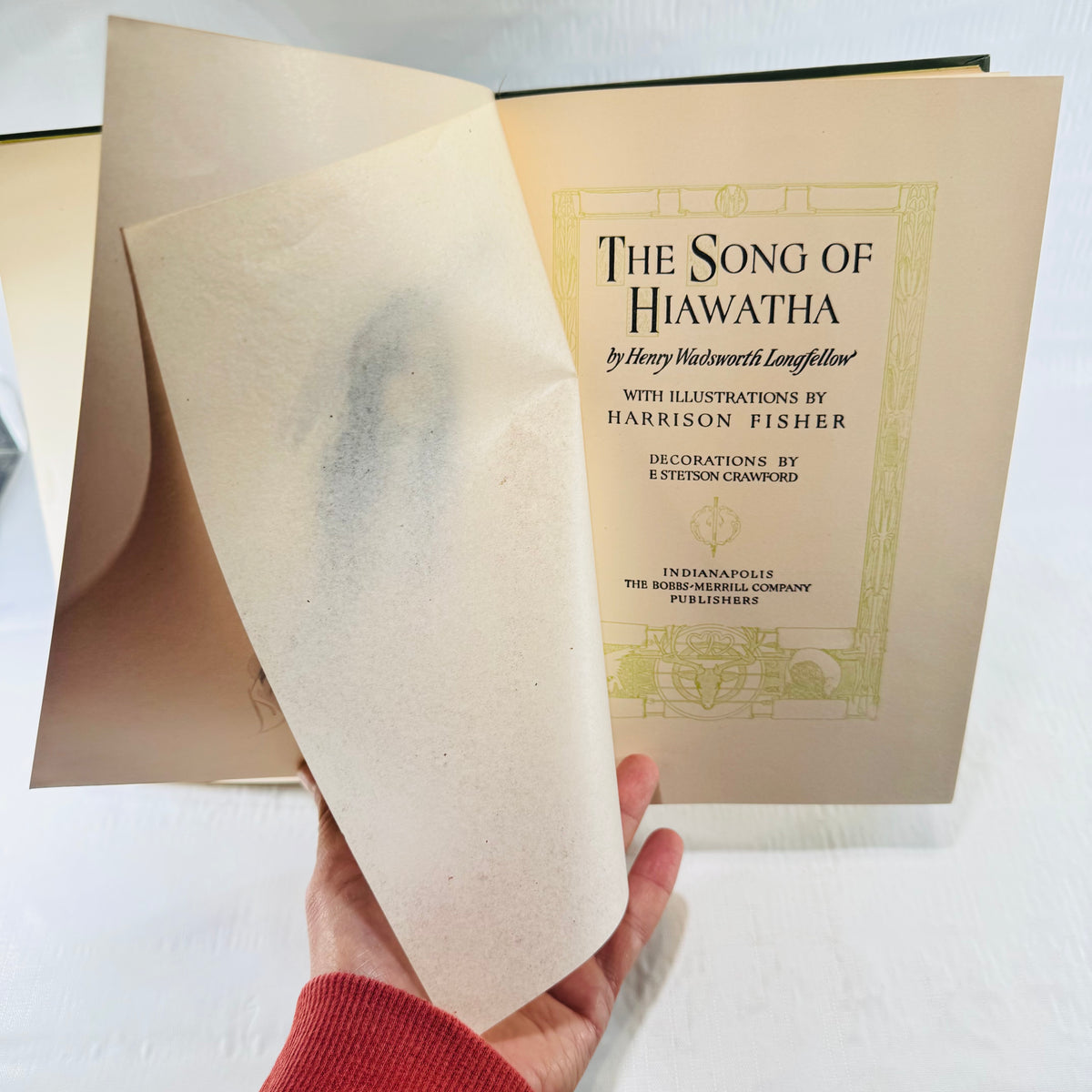 Title page of The Song of Hiawatha with the tissue guard still in place
