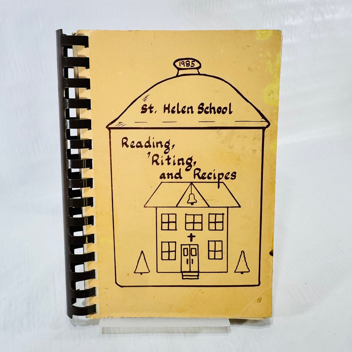 St. Helen School Reading Riting and Recipes 1985 cookbook front cover with schoolhouse drawing
