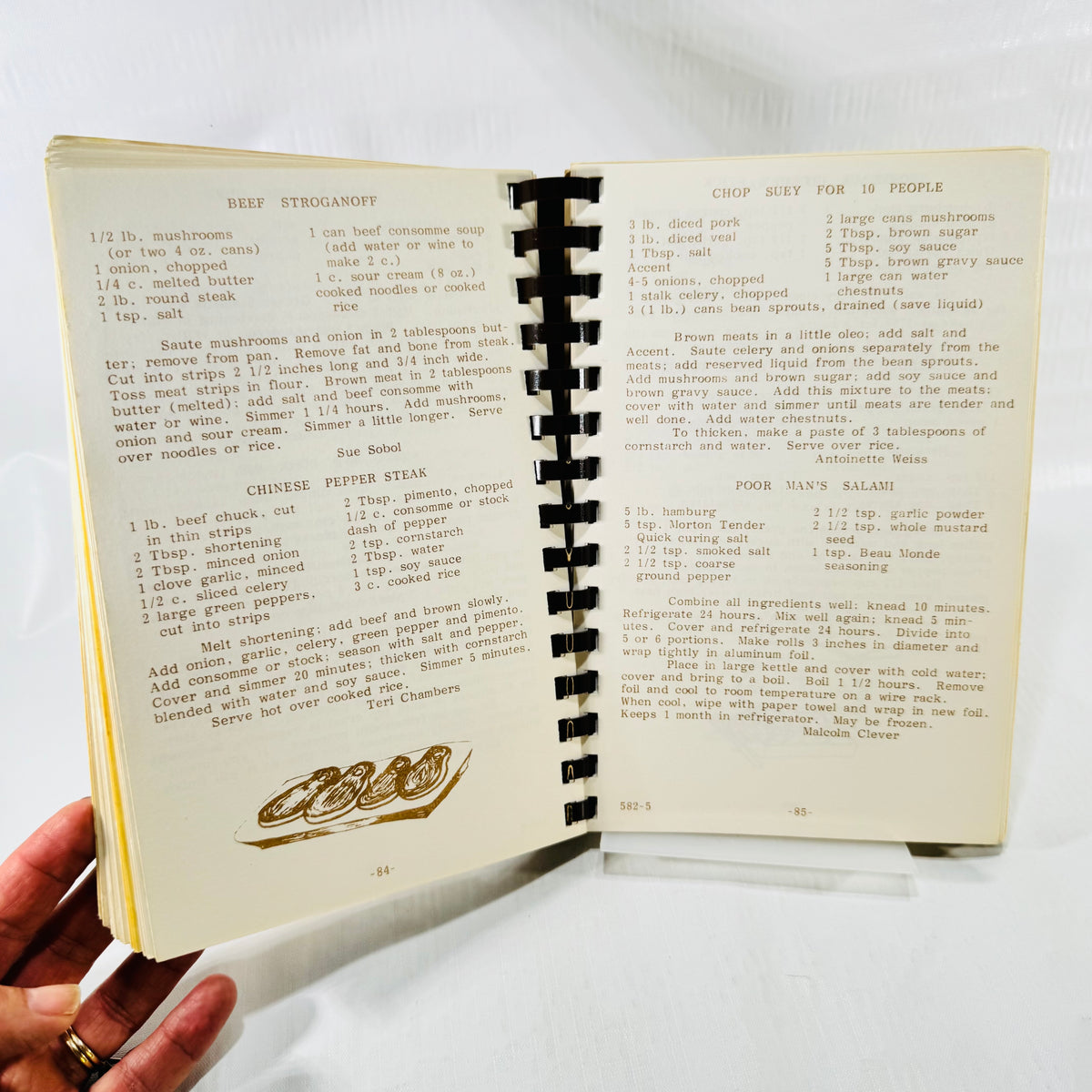 Main dish recipes including Beef Stroganoff and Chop Suey, pages 84 and 85