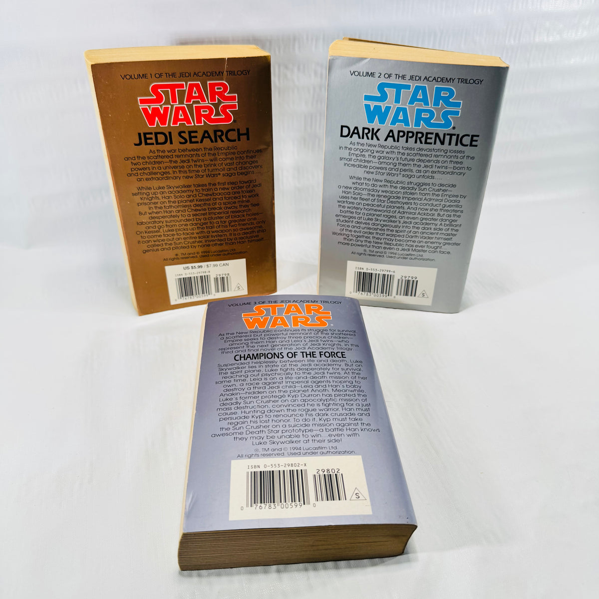 Back covers of all three Star Wars Jedi Academy Trilogy paperbacks with ISBN barcodes.