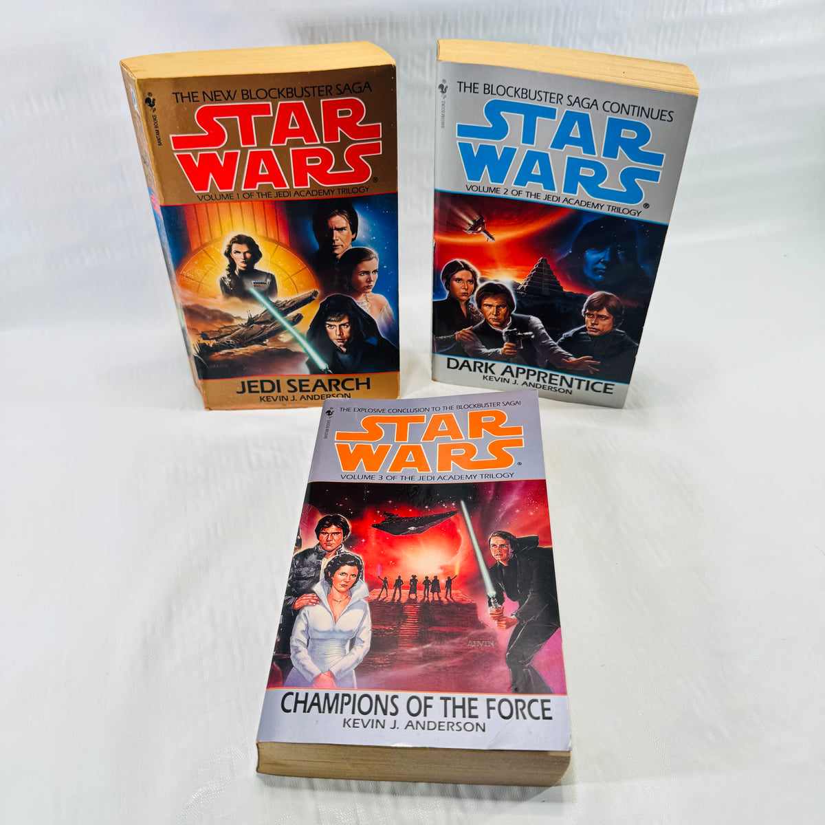 Front covers of all three Star Wars Jedi Academy Trilogy paperbacks by Kevin J. Anderson: Jedi Search, Dark Apprentice, and Champions of the Force.