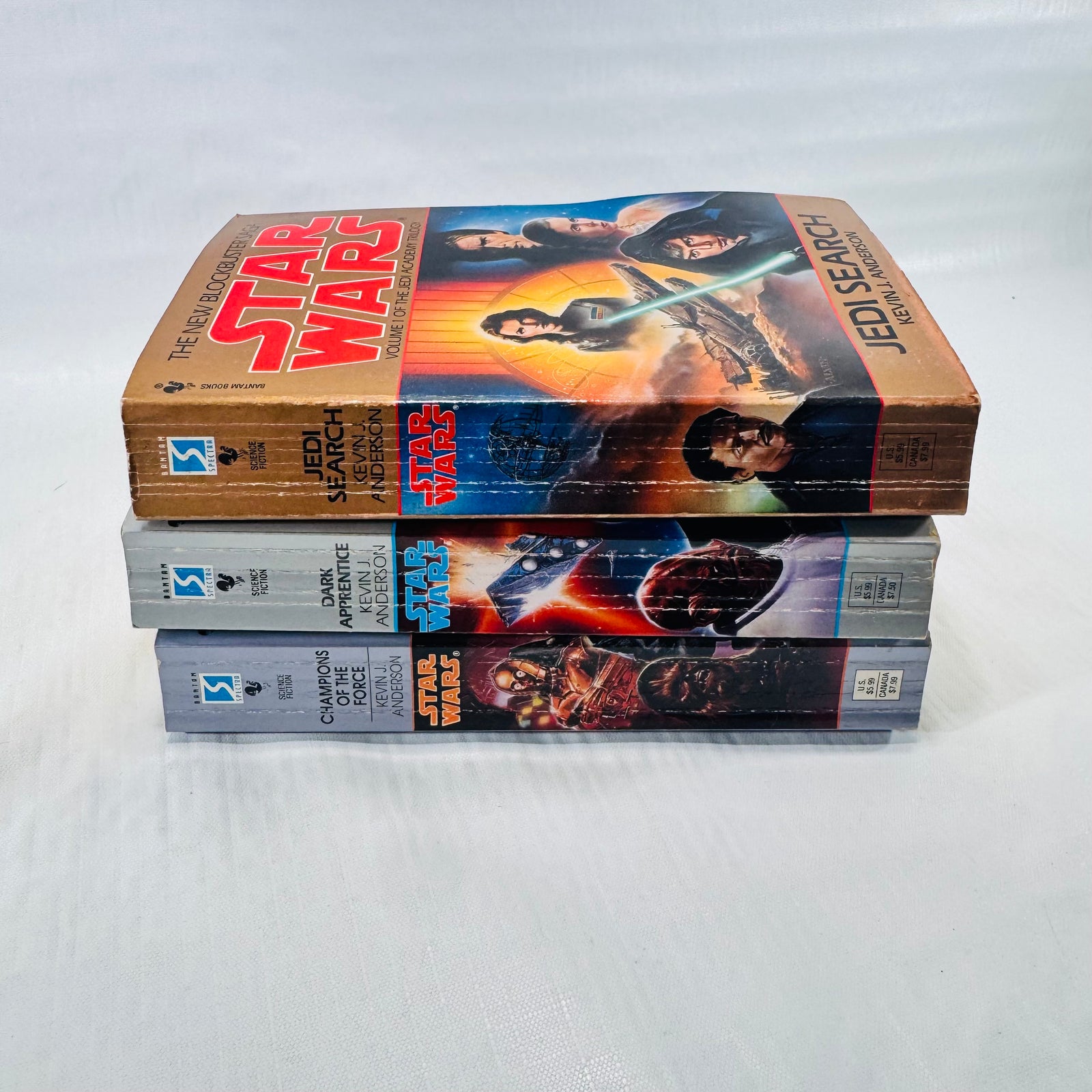 Spines of Jedi Search, Dark Apprentice, and Champions of the Force, showing reading creases on Jedi Search.