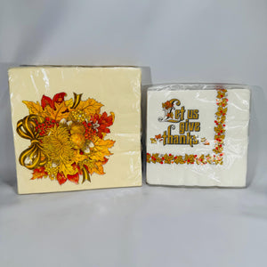 Two sealed packs of vintage Hallmark Thanksgiving paper napkins—harvest leaves bouquet and “Let Us Give Thanks” designs, made in USA, NOS.
