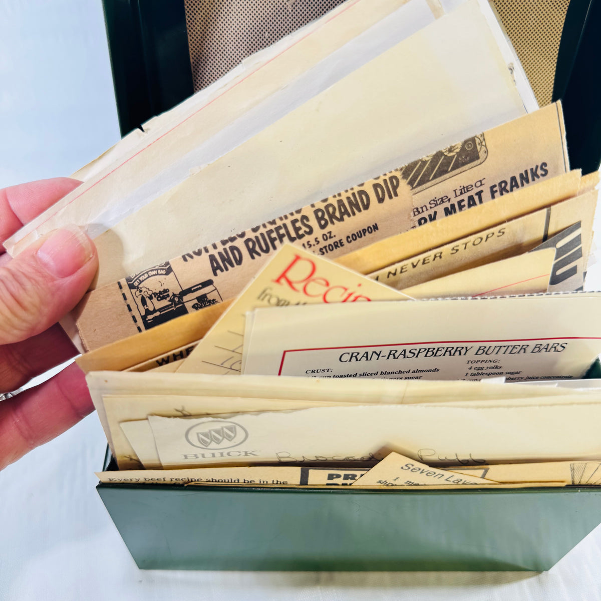 Fanned newspaper recipe clippings with a Ruffles coupon and Cran-Raspberry Butter Bars