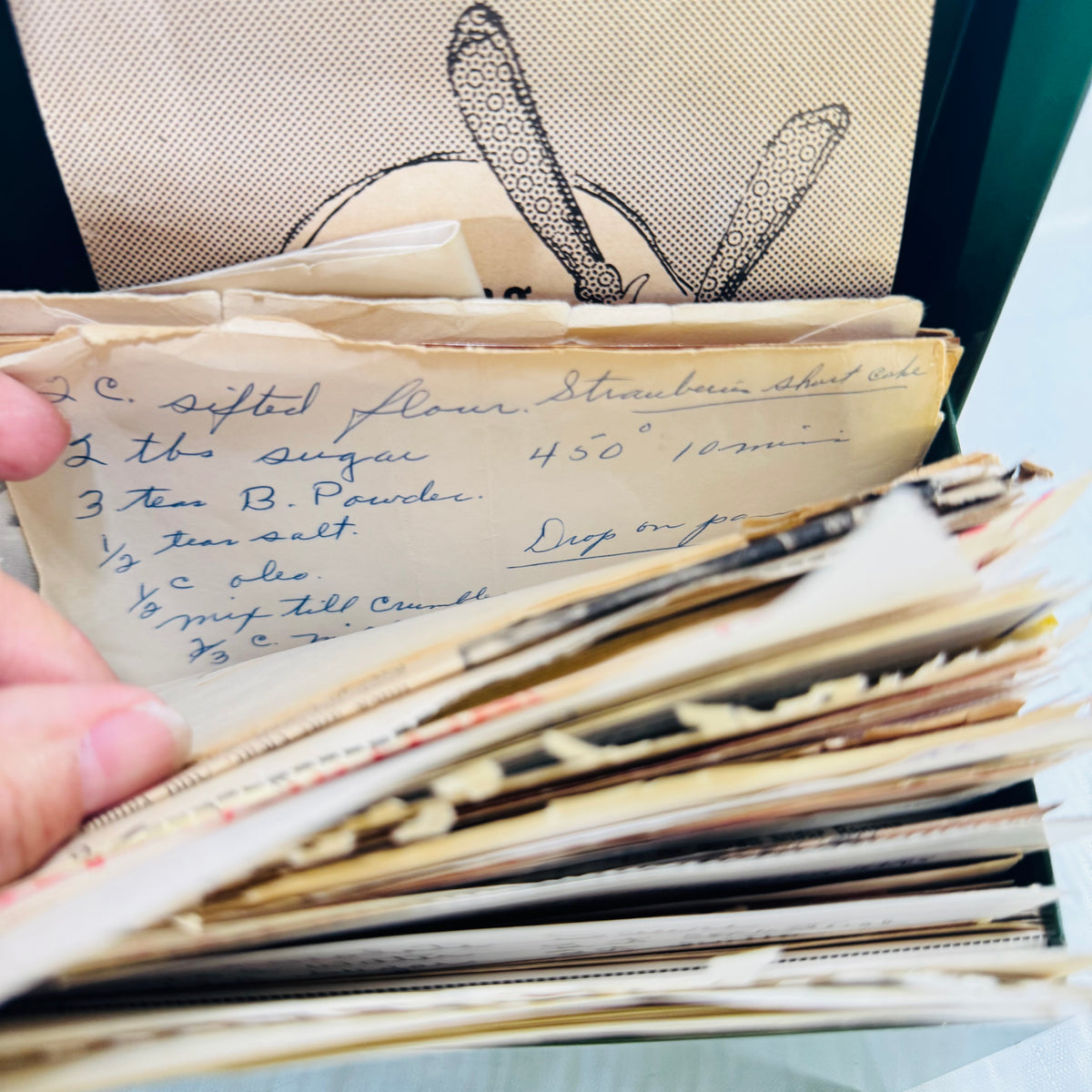Handwritten Strawberry Shortcake recipe card in the vintage recipe box