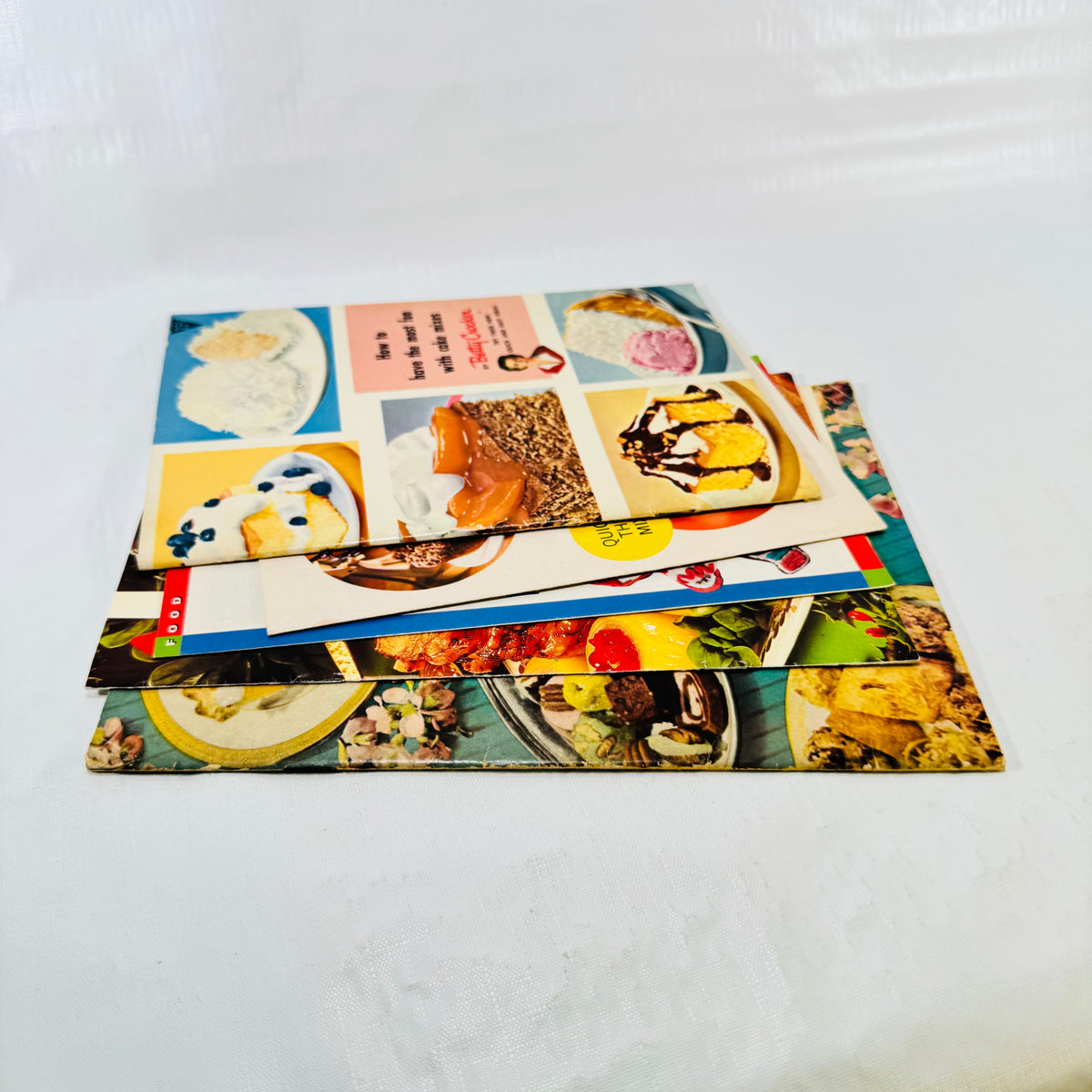 Edge view of the stacked recipe pamphlets showing light wear