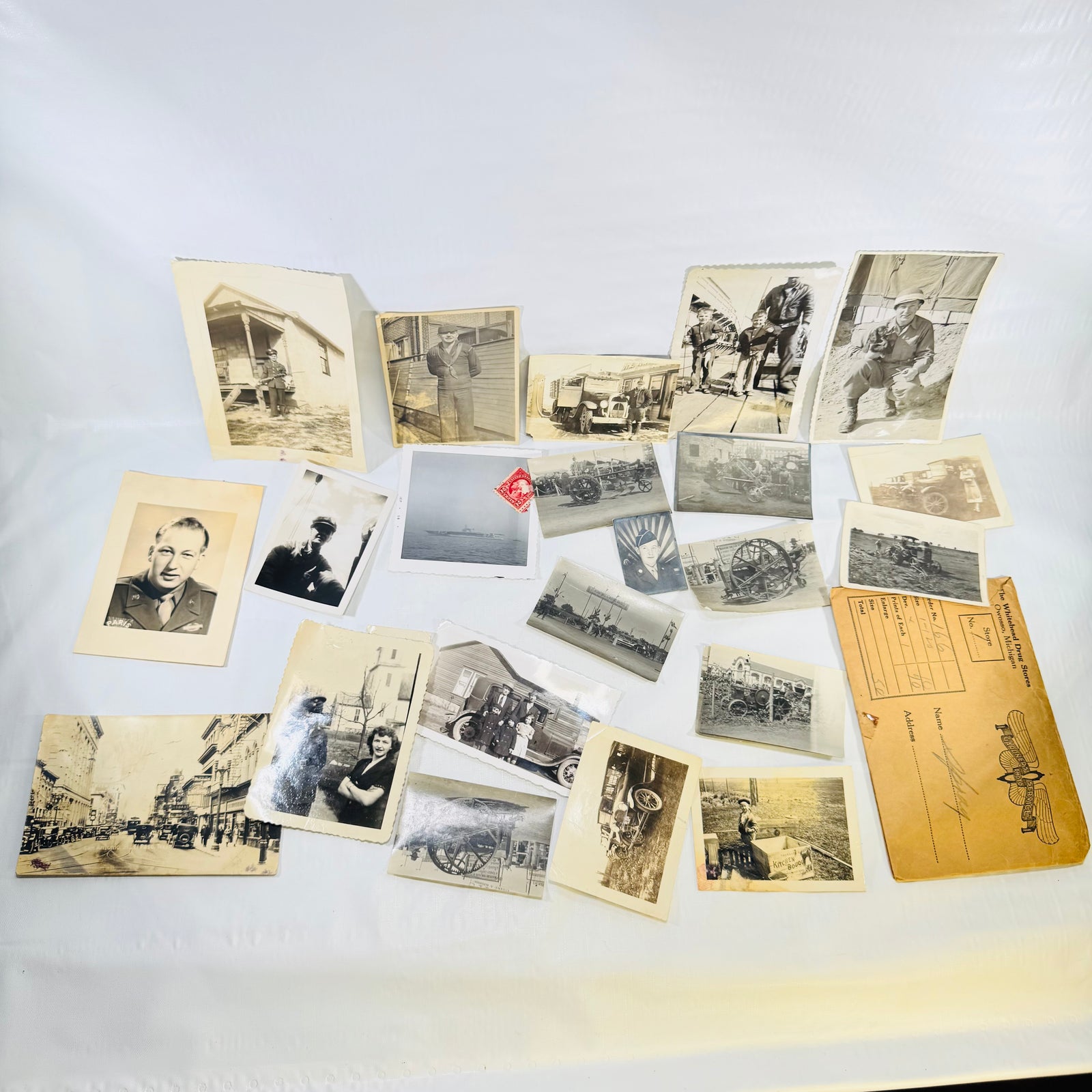 Vintage snapshot photo lot of 24 pieces with the Whitehead Drug Stores Owosso Michigan envelope