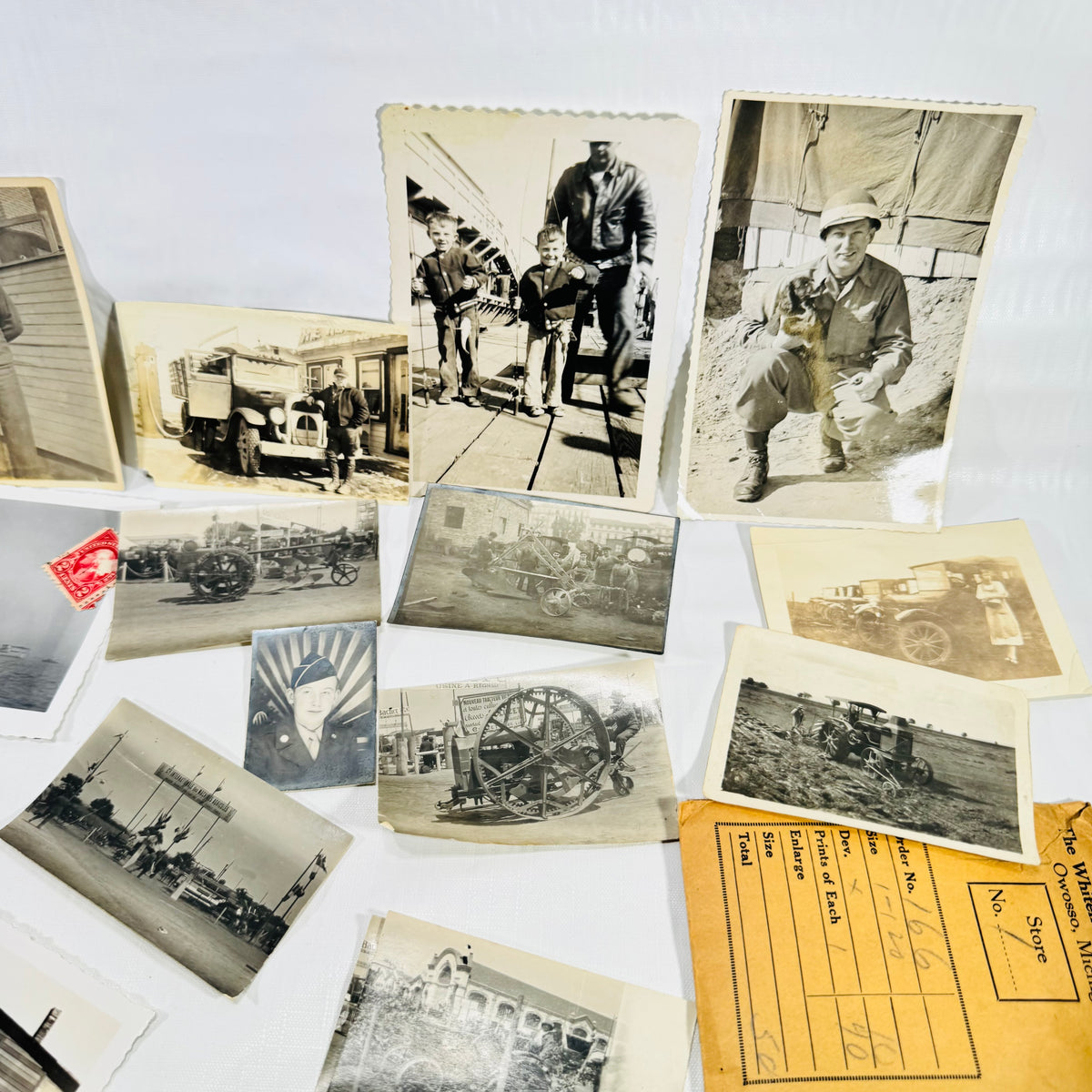 Close-up of vintage snapshots of servicemen and early cars from the Owosso Michigan photo lot