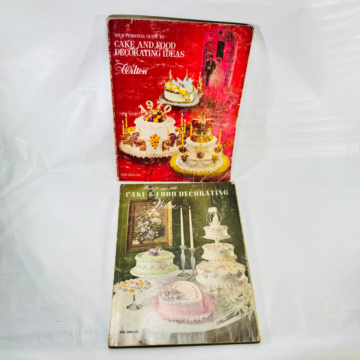 Two vintage Wilton cake decorating books, red 1969 and green 1970-71 front covers