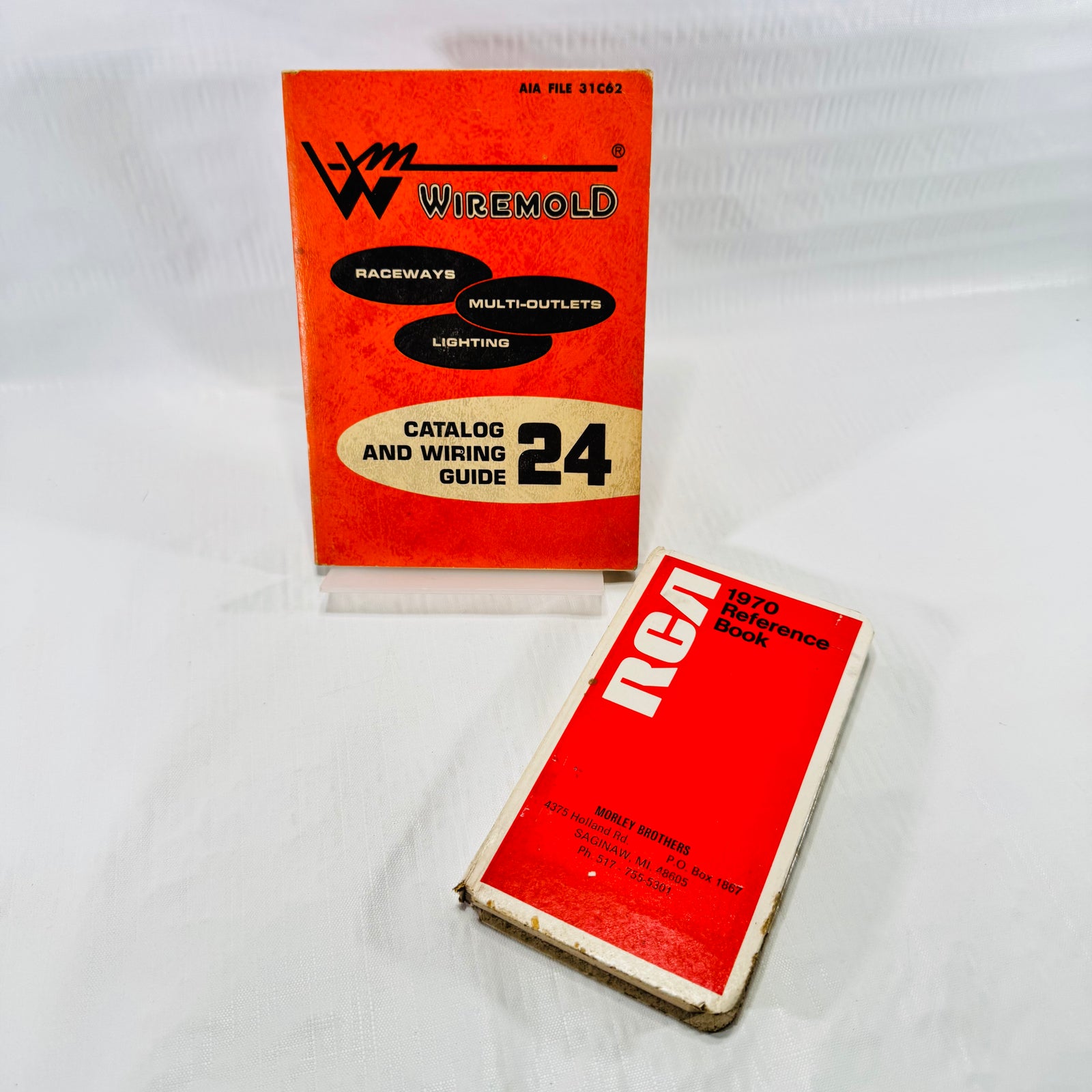Front covers of the Wiremold Catalog and Wiring Guide No. 24 and the red RCA 1970 Reference Book with Morley Brothers imprint.