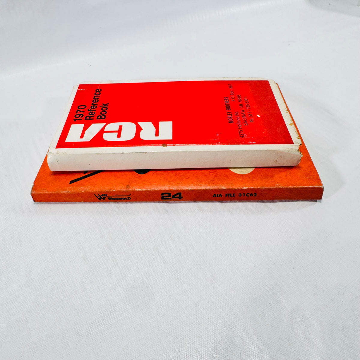 Spines of the Wiremold 24 catalog, AIA File 31C62, and the RCA 1970 Reference Book.