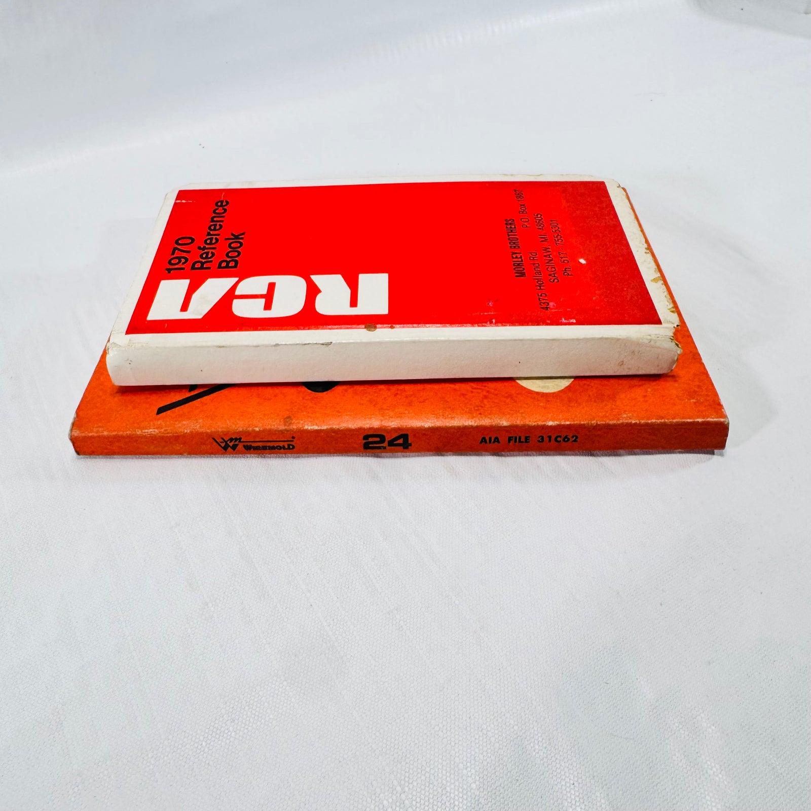 Spines of the Wiremold 24 catalog, AIA File 31C62, and the RCA 1970 Reference Book.