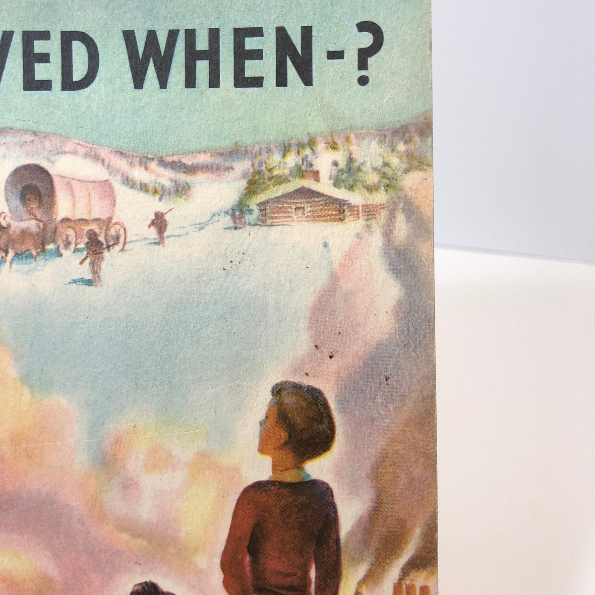 Close view of the covered wagon and log cabin cover art, National Wildlife booklet 1953
