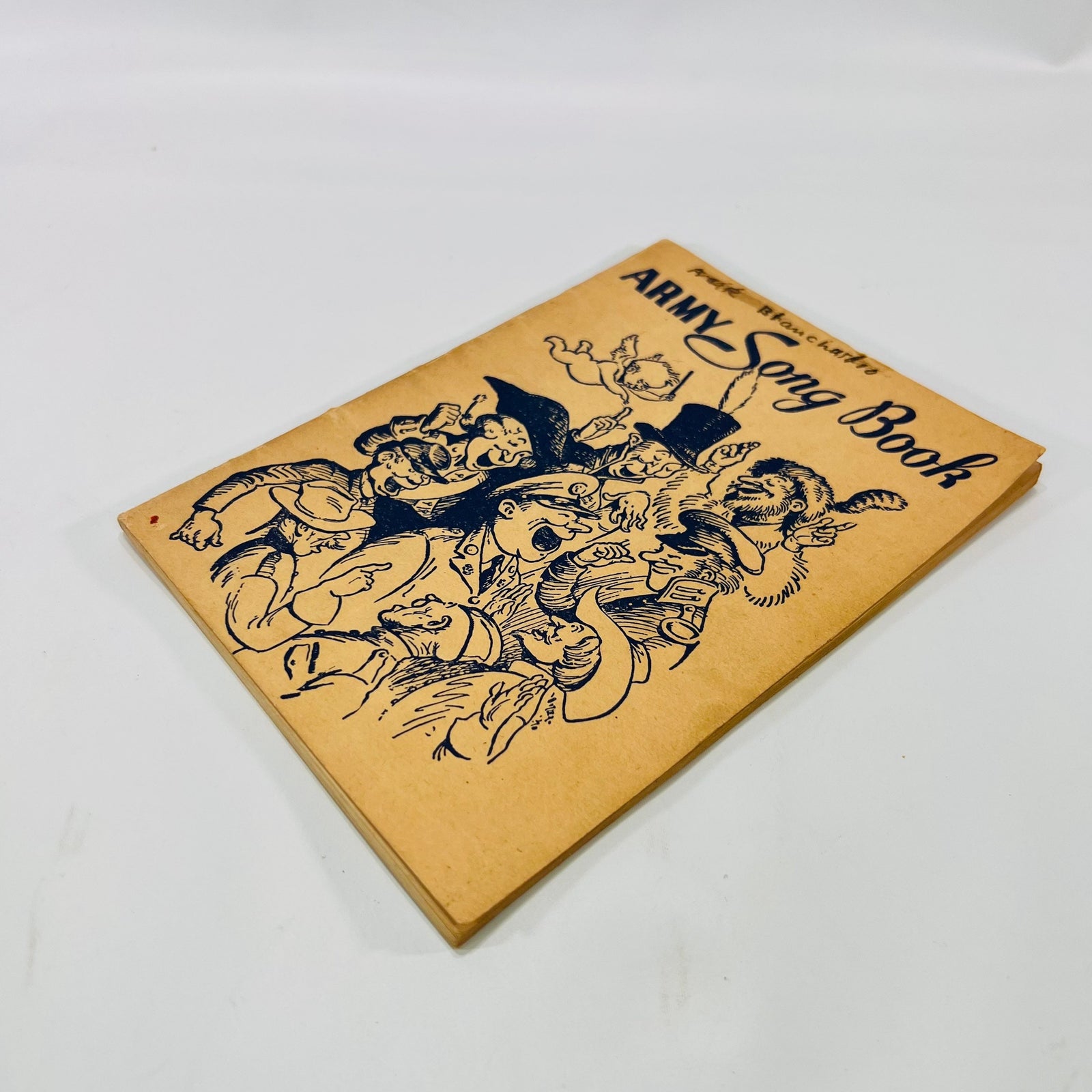 Army Song Book 1941 lying at an angle, showing the toned cover