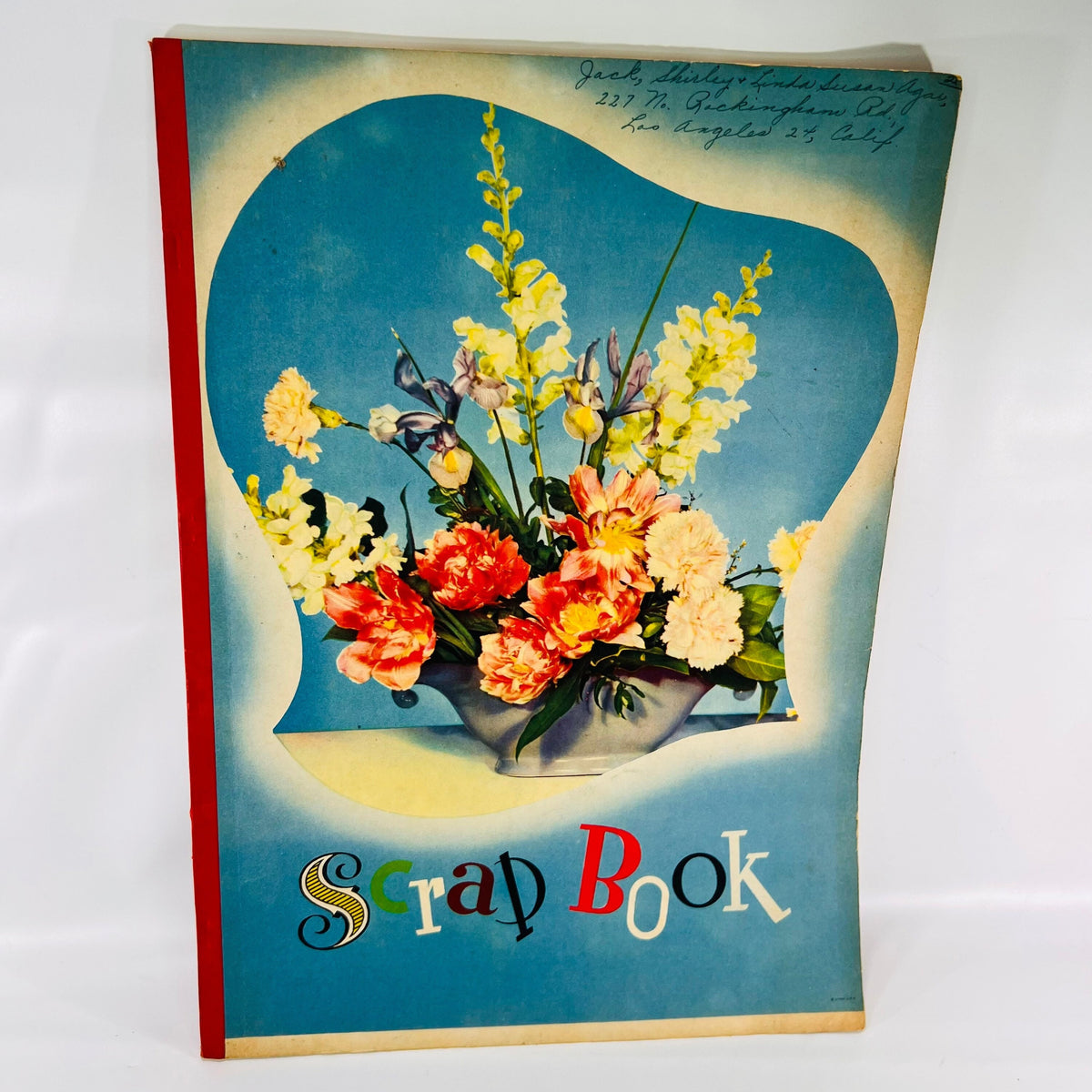 Front cover of the handmade Shirley Temple Scrap Book with a flower bouquet